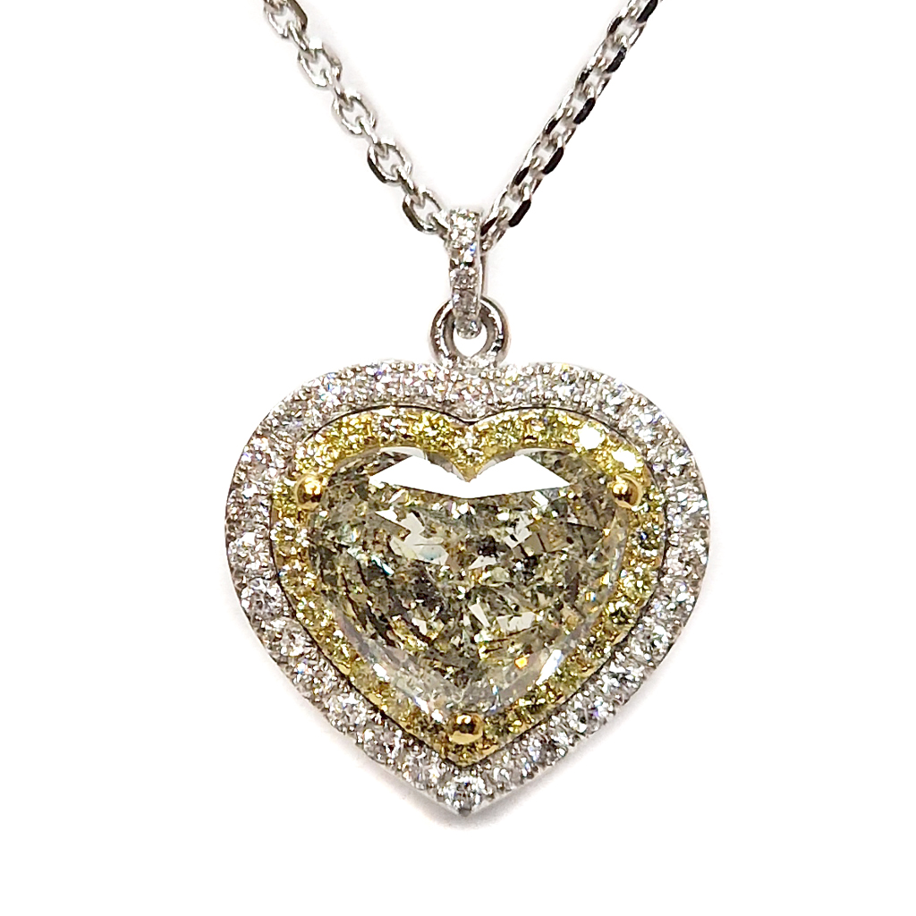 Диамантено колие от бяло и жълто злато 18 карата с диамант във форма на сърце и бели и жълти диаманти